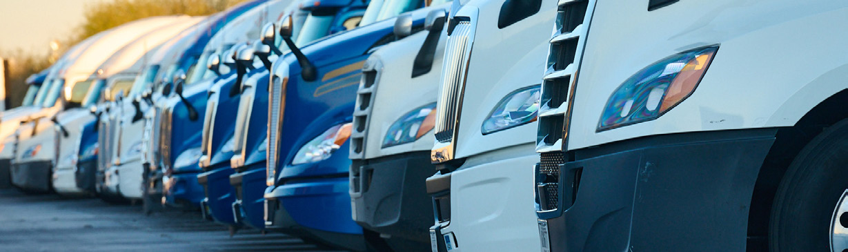 A lineup of Werner trucks parked side by side