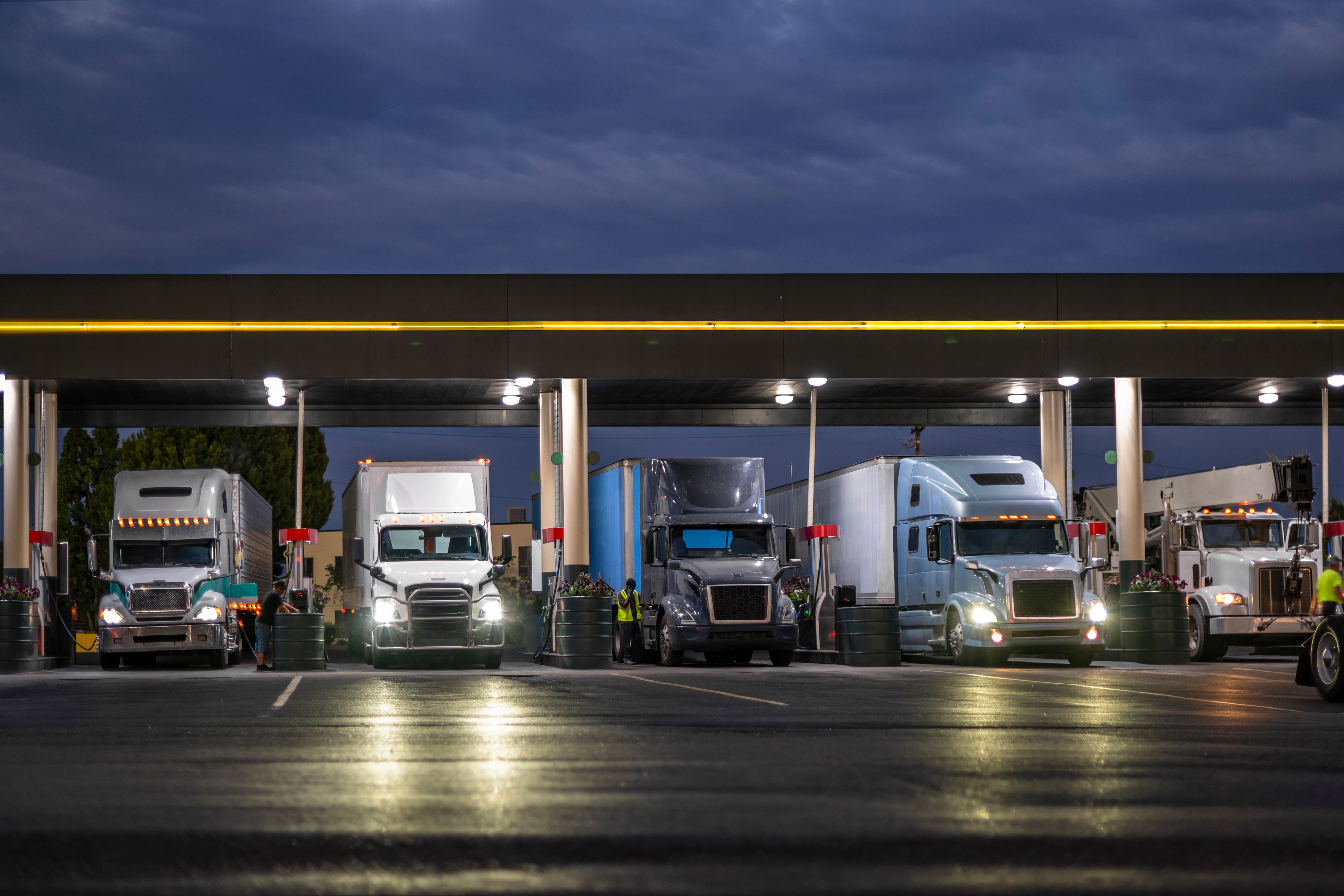 Werner alliance carrier trucks at a fuel island